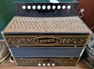 Lot 285 - A vintage button accordion by Hohner, made in...