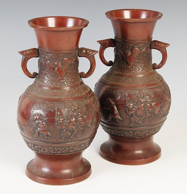 Lot 586 - A pair of Chinese bronze twin-handled vases,...