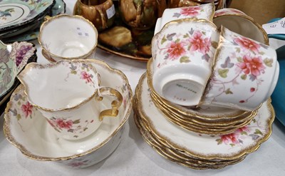 Lot 306 - A Clematis part tea set with gilded borders...