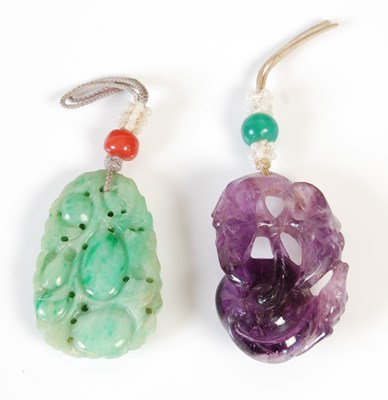 Lot 590 - Two antique Chinese carved stone pendants,...