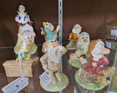 Lot 9 - A group of Royal Doulton ceramic figures to...
