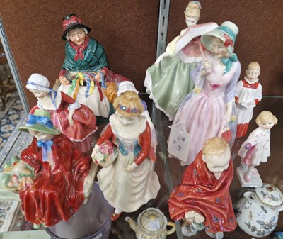 Lot 16 - A group of nine Royal Doulton figures to...
