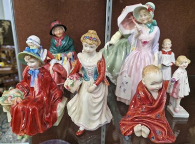 Lot 16 - A group of nine Royal Doulton figures to...