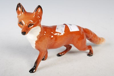 Lot 29 - A Beswick model of a fox, 23.5cm wide.