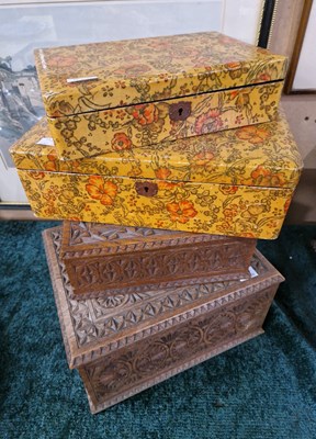 Lot 357 - Two graduated carved wooden storage boxes,...