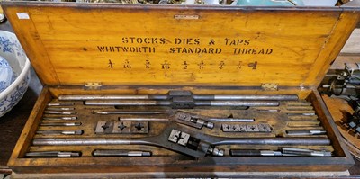 Lot 360 - An antique cased set of stops, dies, and taps,...