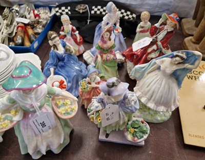 Lot 380 - A group of nine Royal Doulton lady figures...