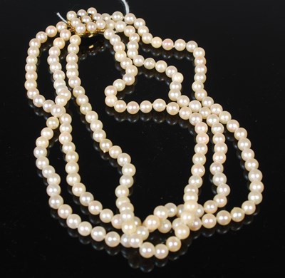 Lot 68 - A 9ct gold sapphire and pearl triple strand...