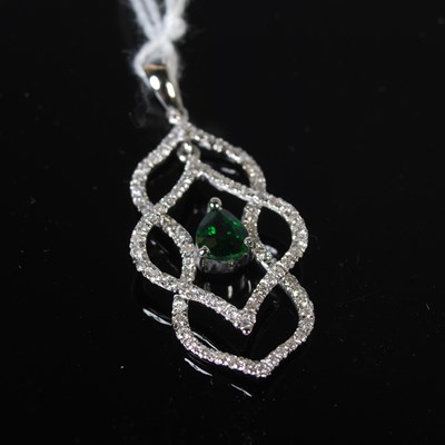 Lot 53 - A white metal, emerald and diamond set pendant,...