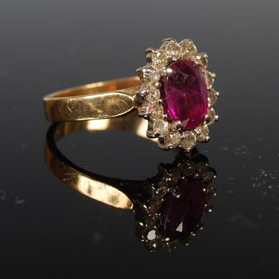 Lot 77 - A yellow metal, ruby and diamond cluster ring,...