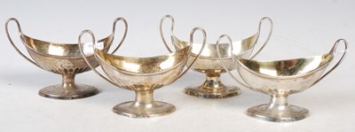 Lot 112 - A set of four antique silver twin handled...
