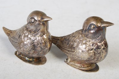 Lot 131 - A pair of novelty white metal bird form pepper...