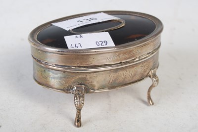 Lot 136 - A silver and tortoiseshell oval dressing table...