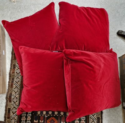 Lot 409A - Four Oka red velvet upholstered cushions.