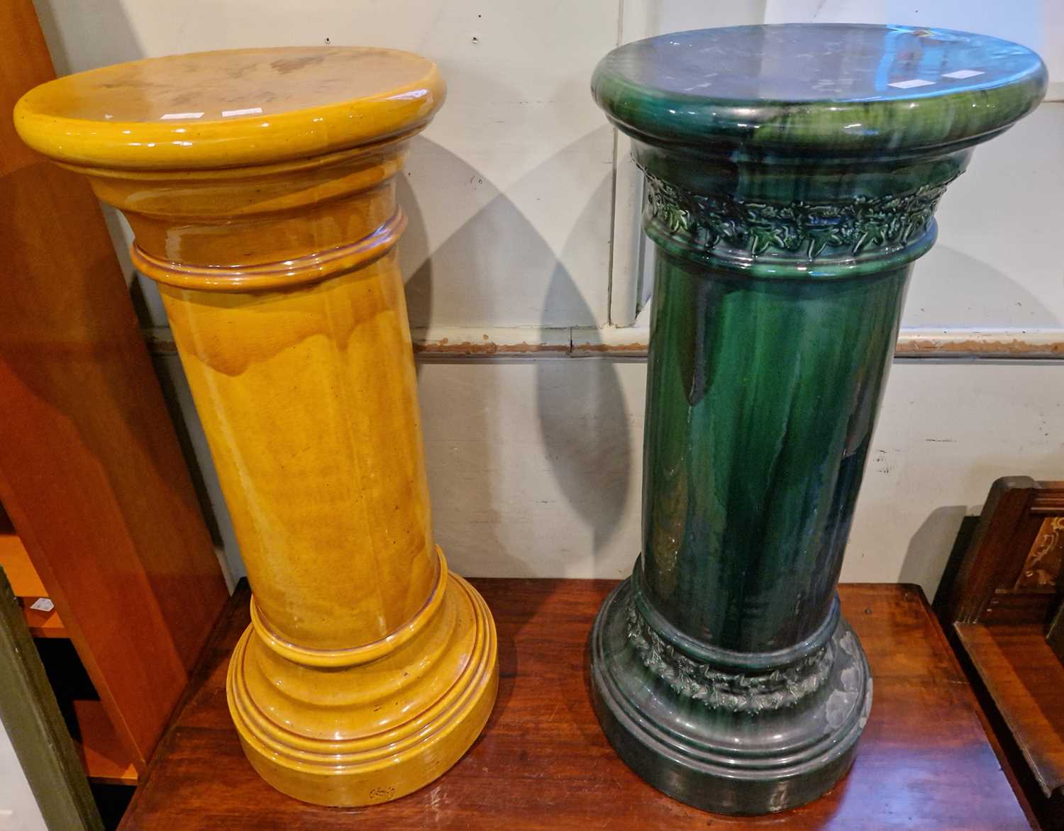 Lot 559 - A green Dunmore pottery pedestal decorated...