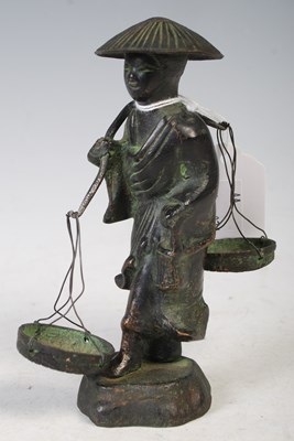 Lot 179 - A Chinese bronzed figure of a plantation...