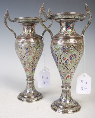Lot 180 - A pair of Persian white metal and enamel...