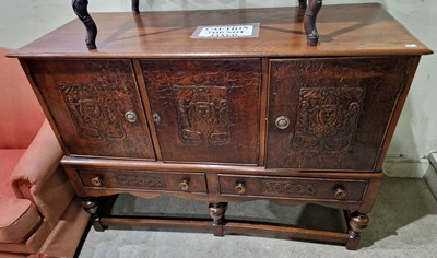 Lot 570 - An early 20th century oak  and embossed...