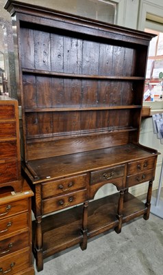 Lot 761 - A George III reproduction oak two-part dresser,...