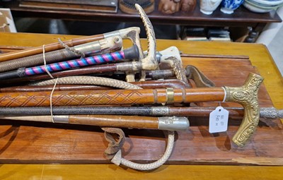 Lot 586 - A collection of assorted riding crops together...