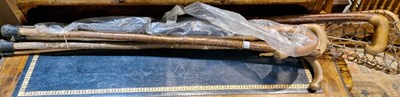 Lot 592 - A group of five assorted vintage walking canes...