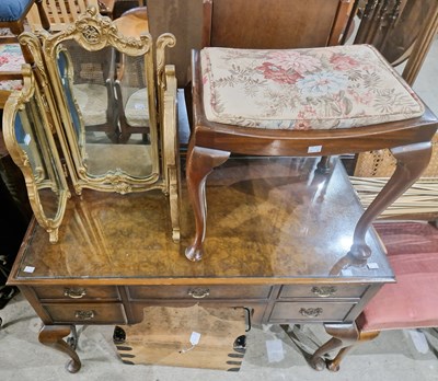 Lot 639 - A reproduction walnut kneehole desk, centred...