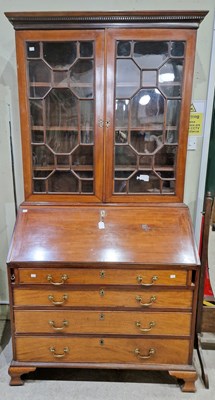 Lot 642 - A 19th century mahogany bureau bookcase, the...