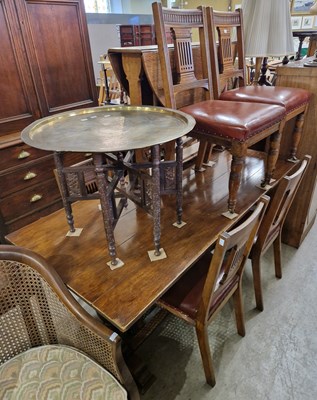 Lot 647 - A late 19th / early 20th century oak dining...