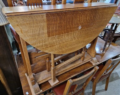 Lot 658 - An early 20th century oak, Arts and Crafts...