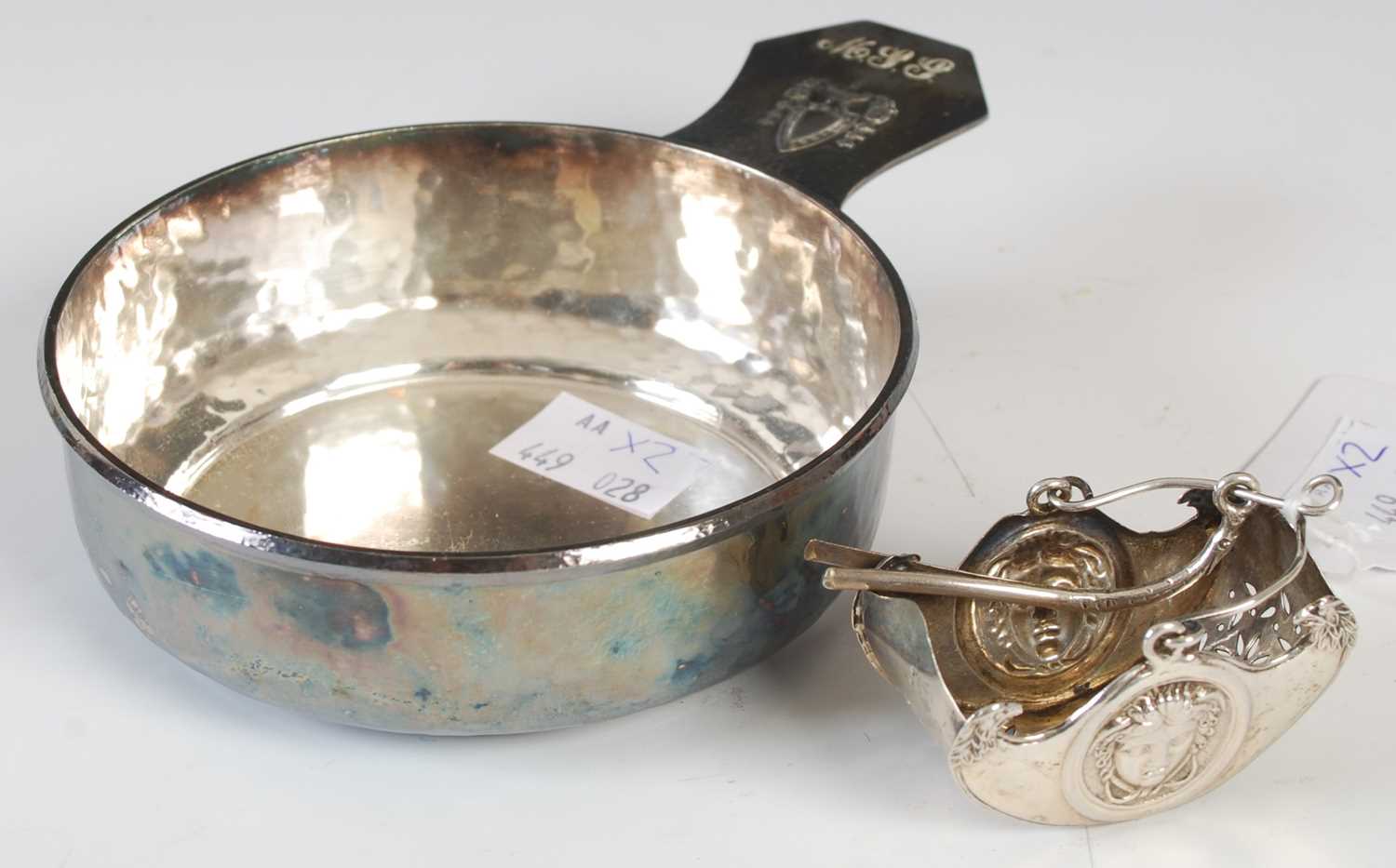 Lot 116 - An American hammered plated porringer with...
