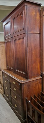 Lot 676 - A 19th century oak two-part cupboard, the...