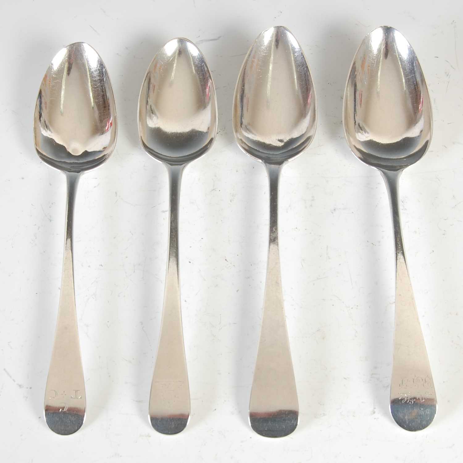 Lot 385 - Four Georgian silver table spoons, to include;...