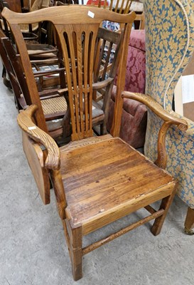 Lot 683 - An antique elm armchair, the right arm with...