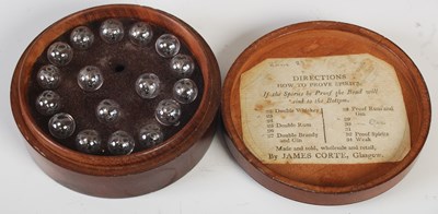 Lot 185 - An antique circular boxed hydrometer with...