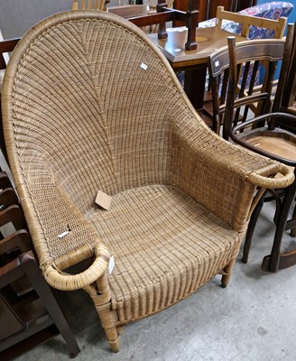 Lot 687 - A 20th century curved back wicker armchair,...