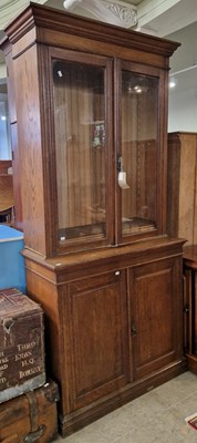 Lot 691 - A 19th century oak two-part bookcase, the...