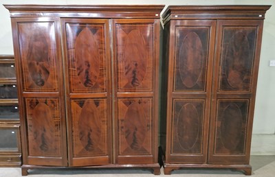 Lot 724 - An Edwardian mahogany and inlaid three-door...