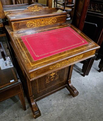 Lot 730 - A 19th century rosewood and inlaid davenport.