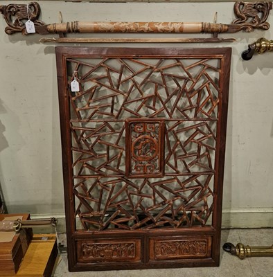 Lot 755 - A Chinese carved wooden screen centred with...