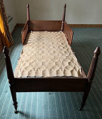 Lot 751 - An antique mahogany single bed, the supports...