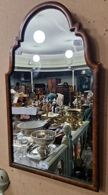 Lot 539 - An early 20th century walnut wall mirror with...