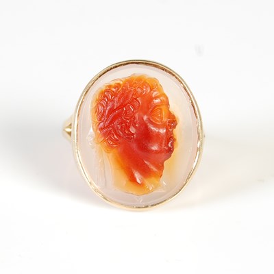 Lot 451 - A yellow metal cameo set ring, set with an...