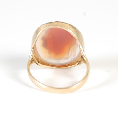 Lot 451 - A yellow metal cameo set ring, set with an...