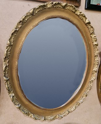 Lot 546 - A rosewood framed rectangular wall mirror...