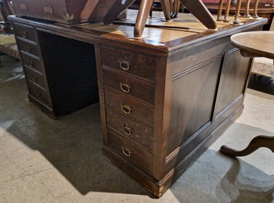 Lot 789 - A 20th century oak partners desk, the...