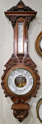 Lot 475 - A Victorian carved mahogany aneroid barometer...