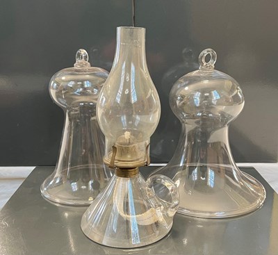 Lot 433 - Two antique clear glass smoke bells, together...