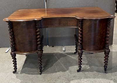 Lot 819 - An antique mahogany inverted bowfront kneehole...