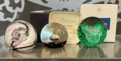 Lot 460 - A group of three Caithness glass paperweights...