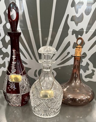 Lot 458 - A group of three assorted glass decanters...